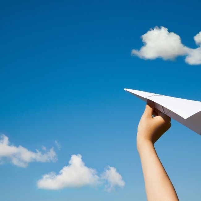 Image depicting paper plane, clouds, fun