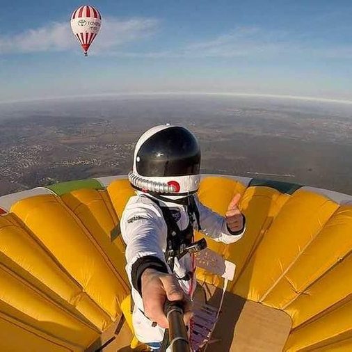 image depicting Frenchman breaks world record for standing on hot air balloon, curious times